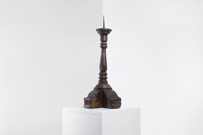 Lot 18 - A walnut pricket candlestick