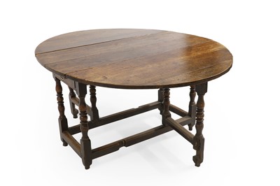 Lot 381 - An oak gateleg table