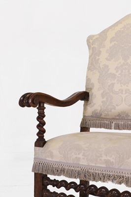 Lot 27 - A pair of large carved-walnut open armchairs