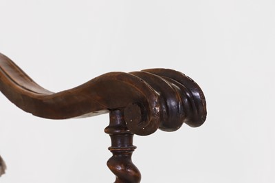Lot 27 - A pair of large carved-walnut open armchairs