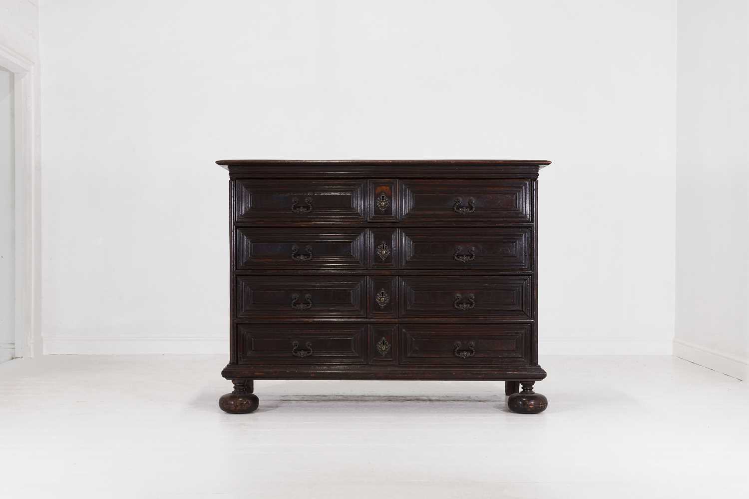 Lot 36 - A large baroque walnut commode or cassettone