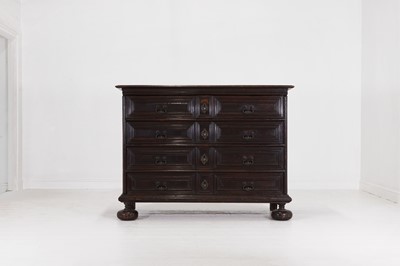 Lot A large baroque walnut commode or cassettone