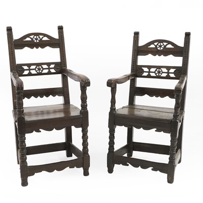 Lot 365 - A matched pair of Argentinian oak armchairs