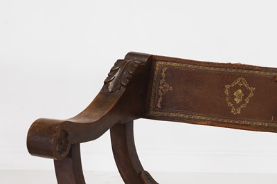 Lot 2 - A pair of Renaissance-style carved walnut Savonarola chairs