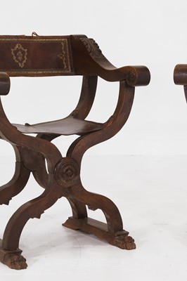 Lot 2 - A pair of Renaissance-style carved walnut Savonarola chairs