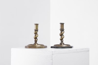 Lot 21 - A near pair of brass candlesticks