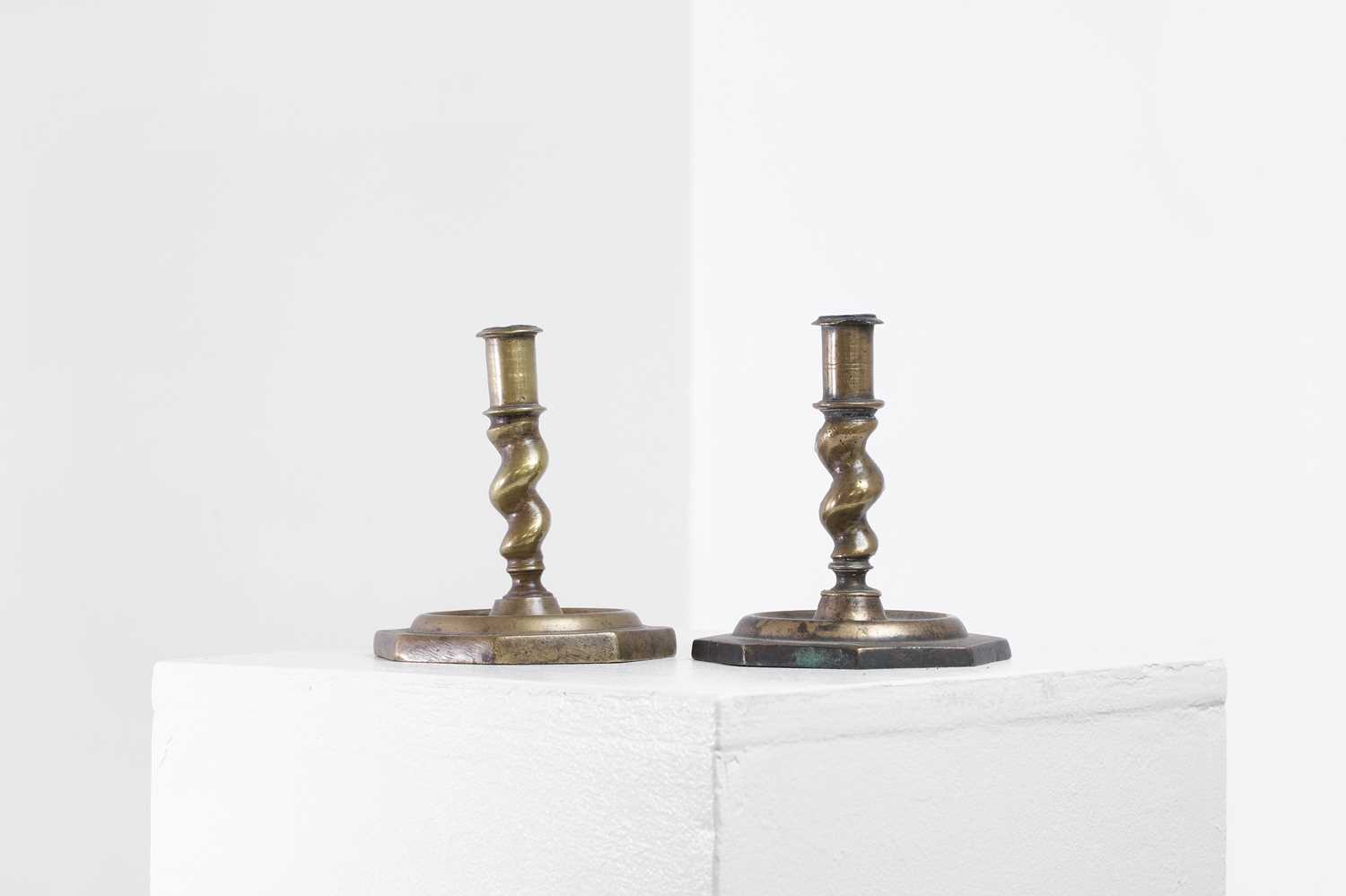 Lot 21 - A near pair of brass candlesticks