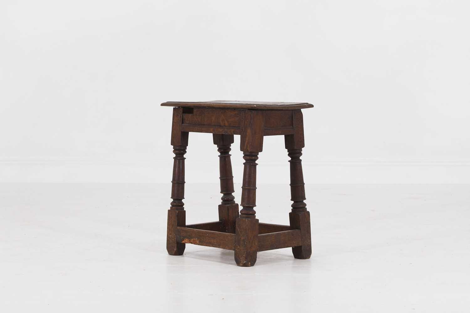 Lot 28 - An oak joint stool
