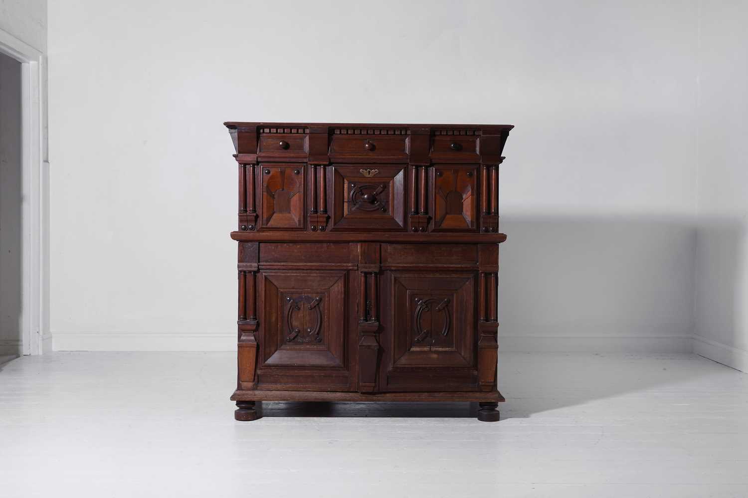 Lot 33 - A Charles II oak enclosed chest of drawers