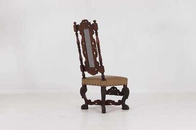Lot 17 - A baroque-style carved walnut side chair