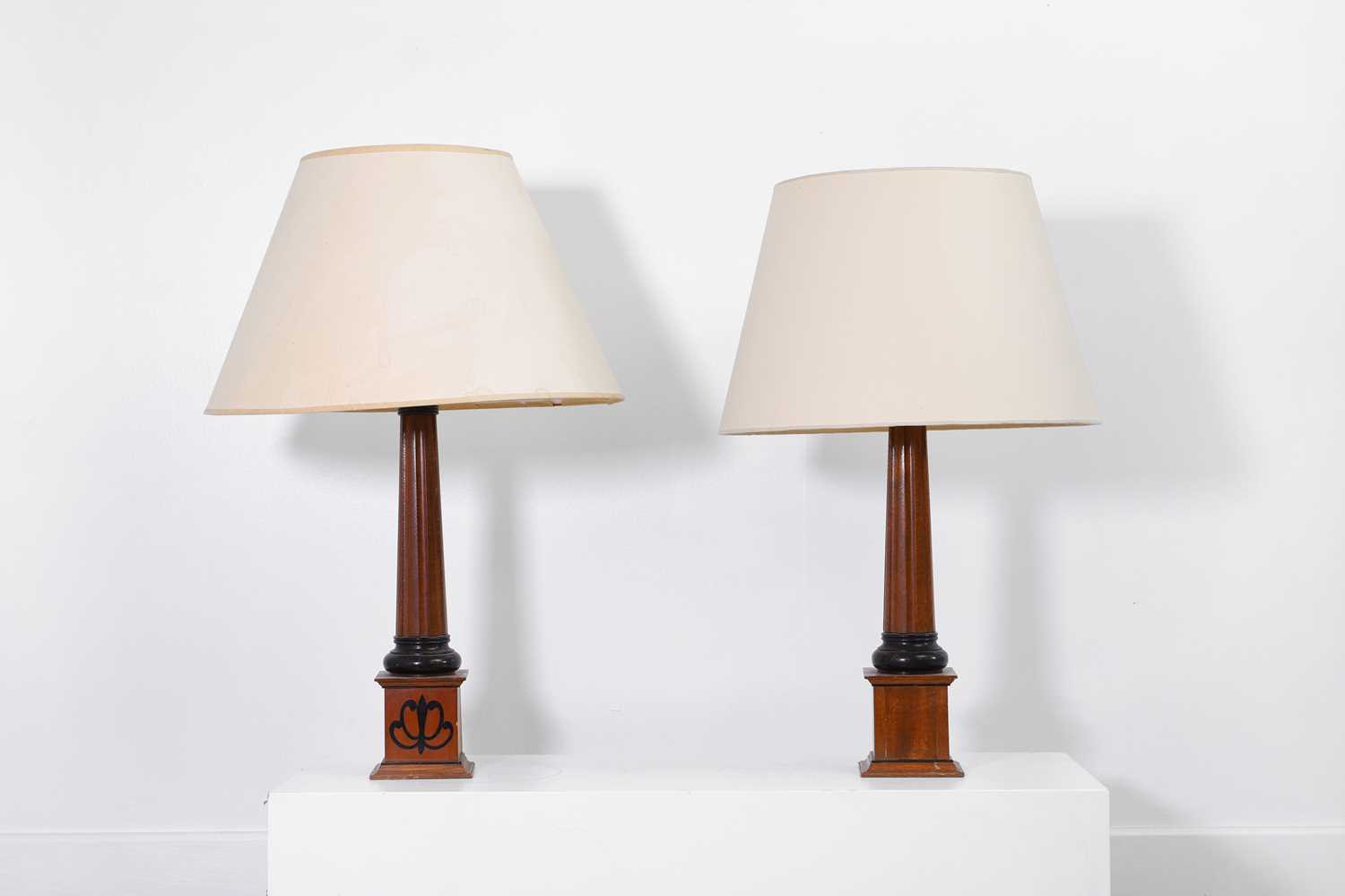 Lot 15 - A pair of mahogany table lamps by Linley