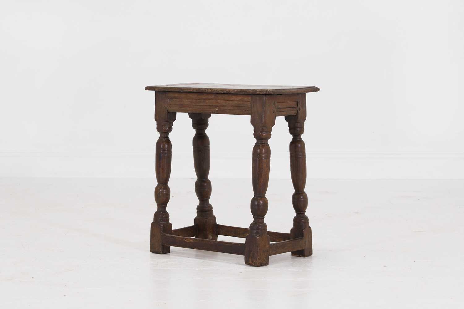 Lot 34 - An oak joint stool