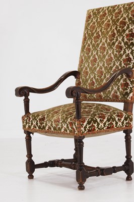 Lot 20 - A carved walnut open armchair