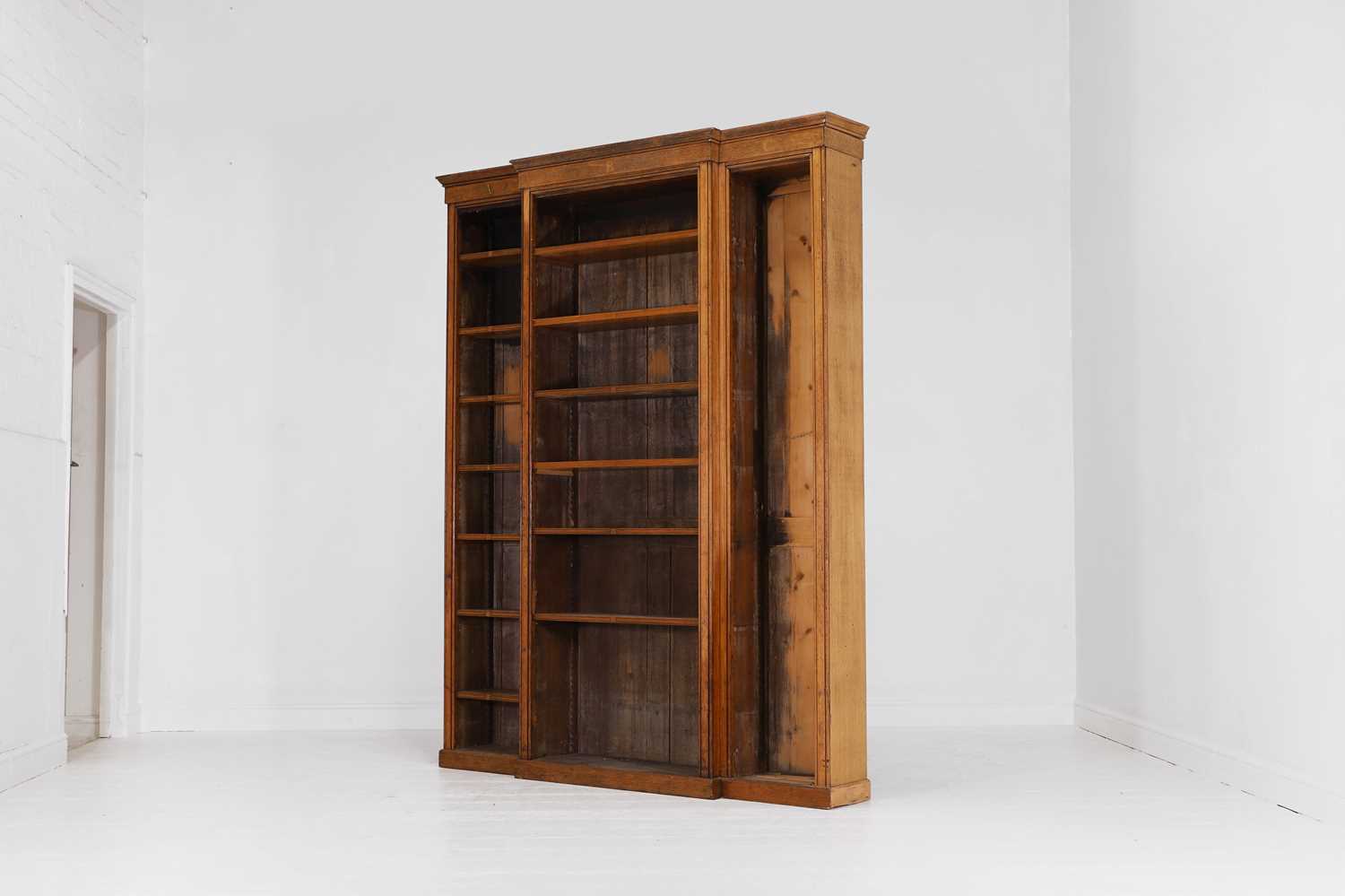 Lot 338 - An oak breakfront library bookcase