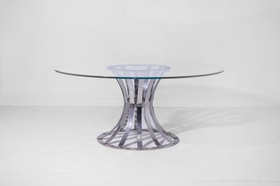 Lot 375 - A glass and chrome dining table by Davidson, London