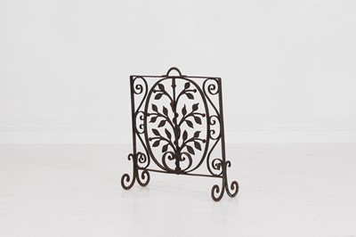 Lot 379 - A painted wrought-iron fireguard