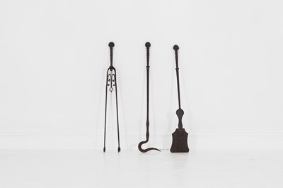 Lot 84 - A set of three wrought-steel fire tools