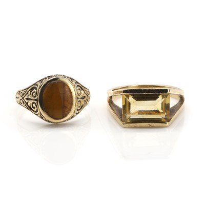 Lot 312 - A 9ct gold tiger's eye ring and a 9ct citrine single stone ring