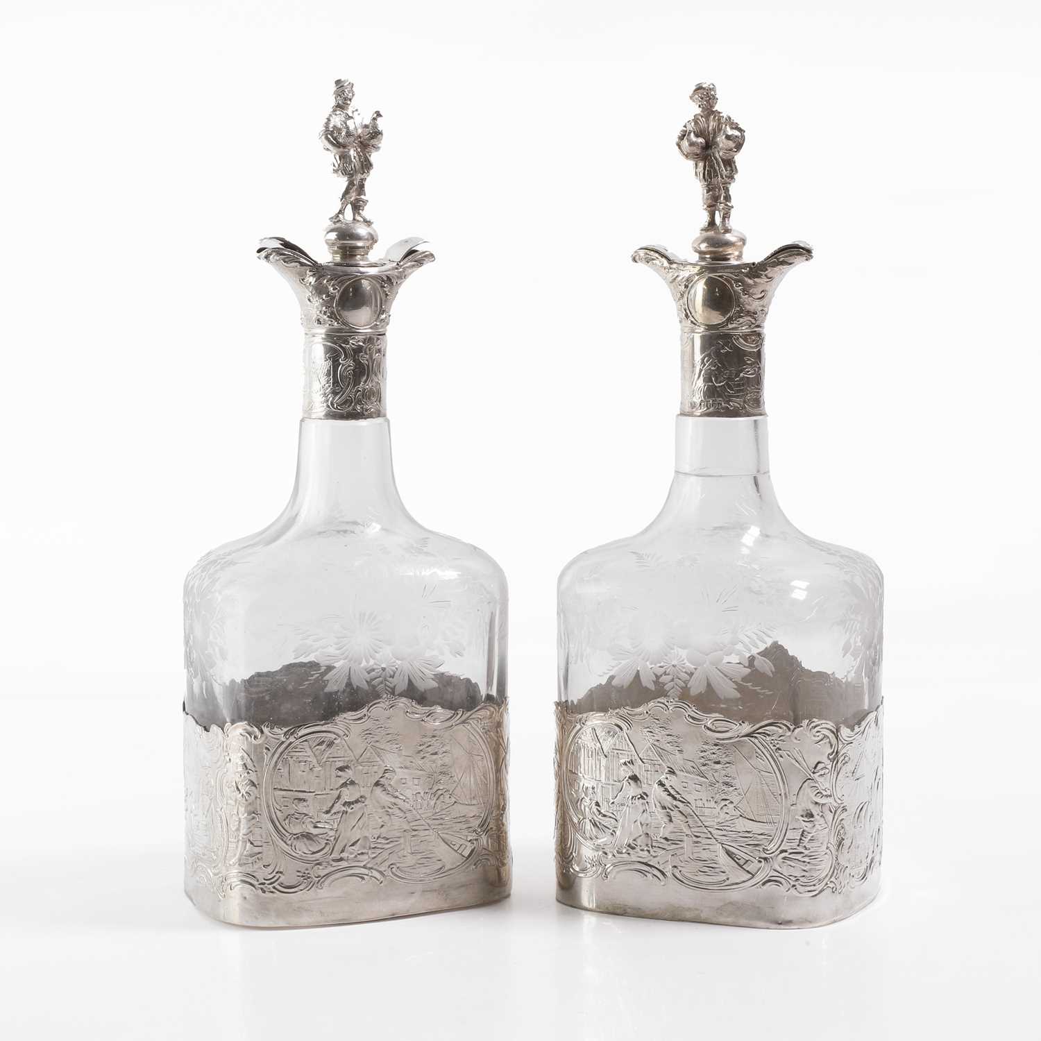 Lot 50 - A pair of silver-mounted glass decanters
