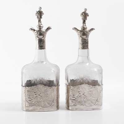 Lot 50 - A pair of silver-mounted glass decanters