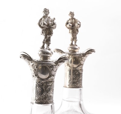 Lot 50 - A pair of silver-mounted glass decanters