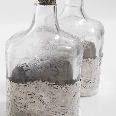 Lot 50 - A pair of silver-mounted glass decanters