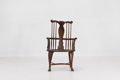 Lot 150 - A George III ash, elm and fruitwood comb-back Windsor armchair