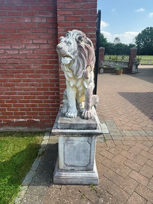 Lot 468 - A pair of reconstituted lion sculptures