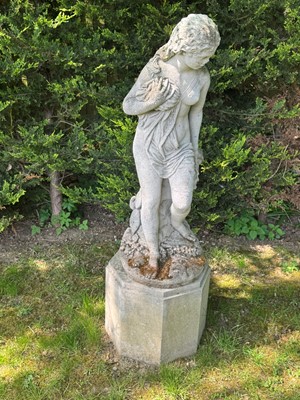 Lot 521 - Three reconstituted stone figures