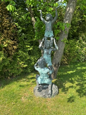 Lot 609 - A bronze of three children