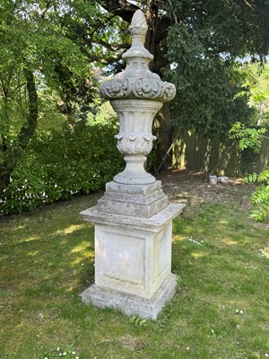 Lot 613 - A massive reconstituted garden urn on stand