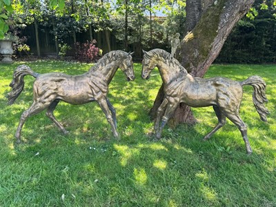 Lot 604 - A pair of bronze stallions
