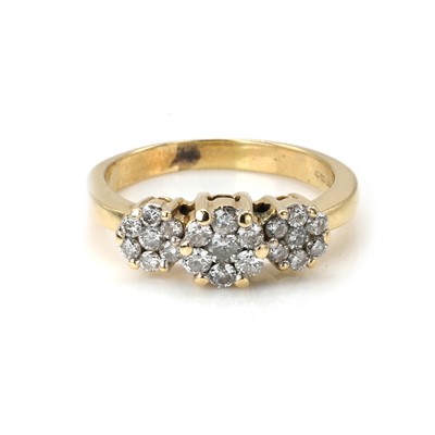 Lot 99 - A 14ct gold diamond triple cluster ring