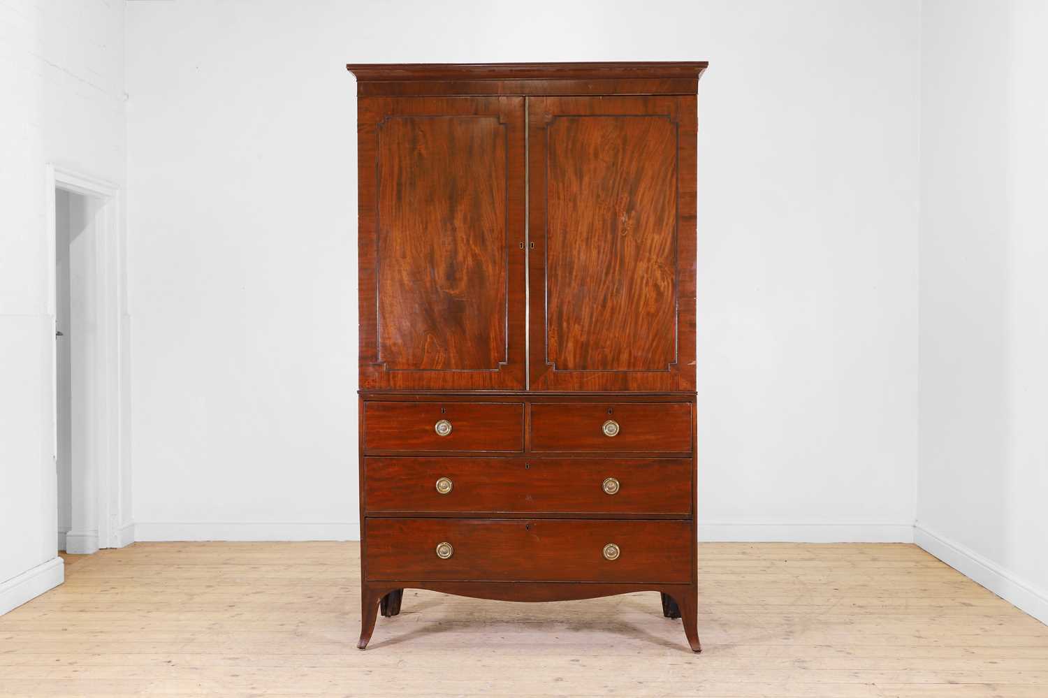 Lot 179 - A George III mahogany linen press