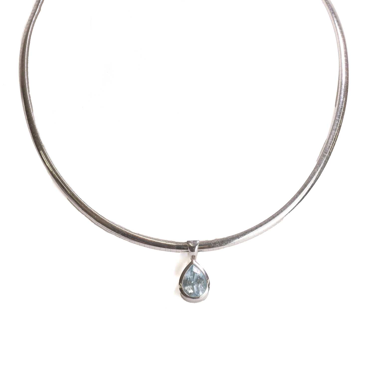 Lot 150 - An 18ct white gold topaz pendant and chain