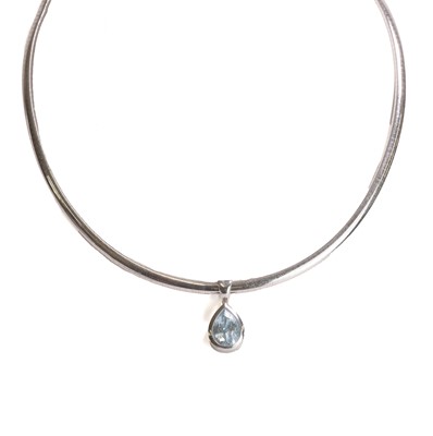 Lot 150 - An 18ct white gold topaz pendant and chain