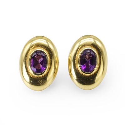 Lot 128 - A pair of gold and amethyst clip-on earrings