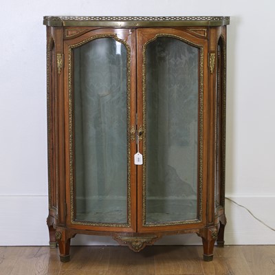 Lot 490 - A brass bound Kingswood vitrine cabinet