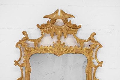 Lot 492 - A George III-style carved giltwood pier mirror