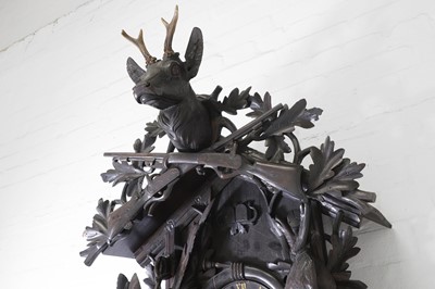 Lot 235 - A Black Forest carved wooden cuckoo clock