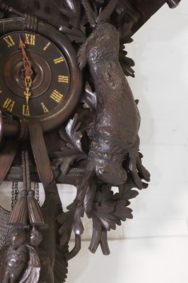 Lot 235 - A Black Forest carved wooden cuckoo clock