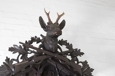 Lot 235 - A Black Forest carved wooden cuckoo clock