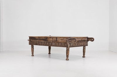 Lot 81 - A carved wooden low table