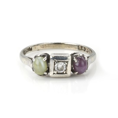 Lot 27 - A diamond, chrysoberyl and ruby three stone ring