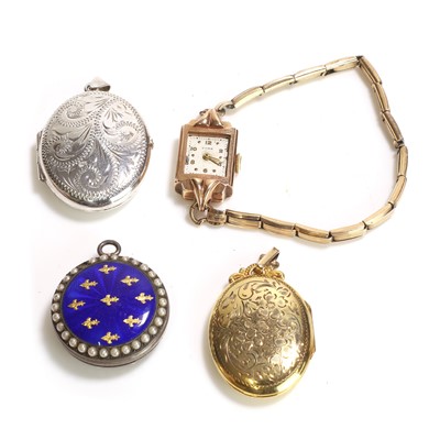 Lot 351 - A group of three locket pendants and a mechanical bracelet watch