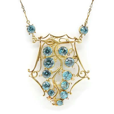 Lot 63 - A gold and blue zircon pendant brooch, c1940s