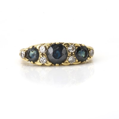 Lot 142 - A sapphire and diamond three stone ring