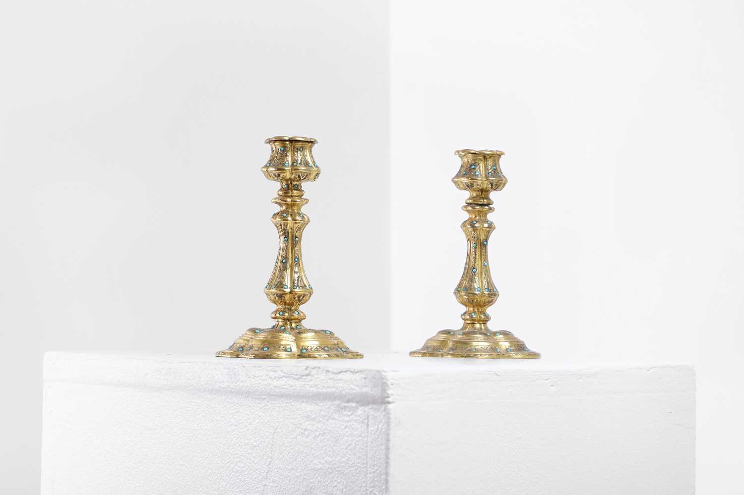 Lot 304 - A pair of gilt-bronze candlesticks