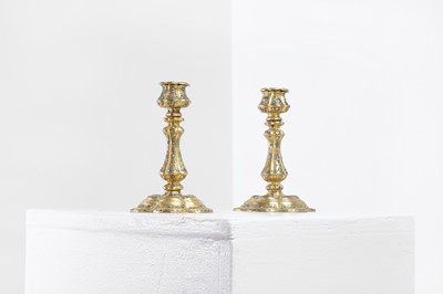 Lot 304 - A pair of gilt-bronze candlesticks
