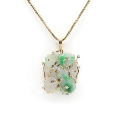 Lot 212 - A carved jade and diamond pendant